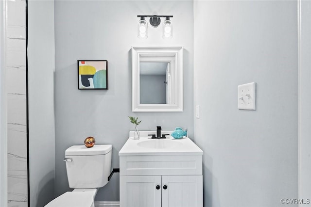 bathroom with toilet and vanity