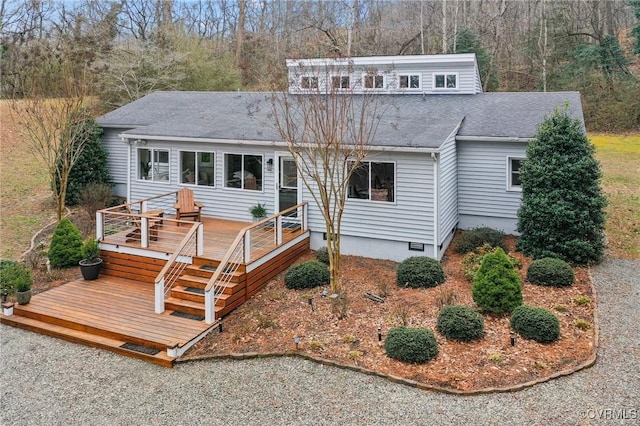 view of front of home with crawl space, a shingled roof, and a wooden deck