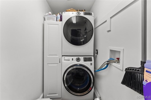 laundry room featuring laundry area and stacked washing maching and dryer