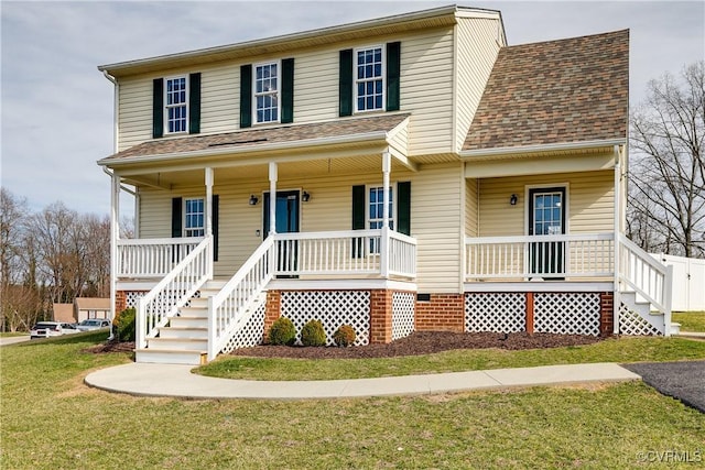 view of front of property with covered porch, a front lawn, and roof with shingles