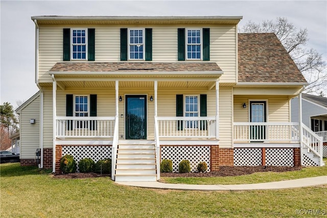 view of front of house with a front lawn, covered porch, and a shingled roof