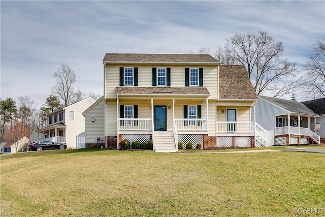 view of front of property featuring a front lawn, covered porch, and roof with shingles