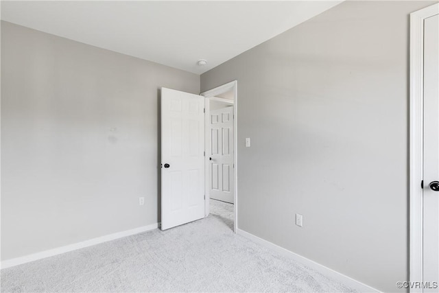 unfurnished bedroom with baseboards and carpet floors