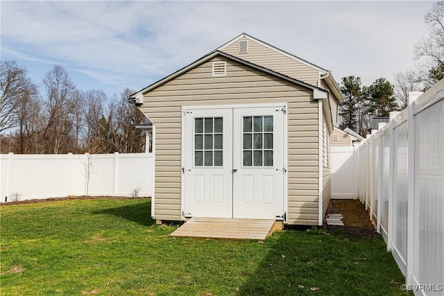 view of shed with a fenced backyard