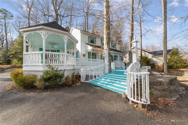 view of front of property with covered porch and ceiling fan