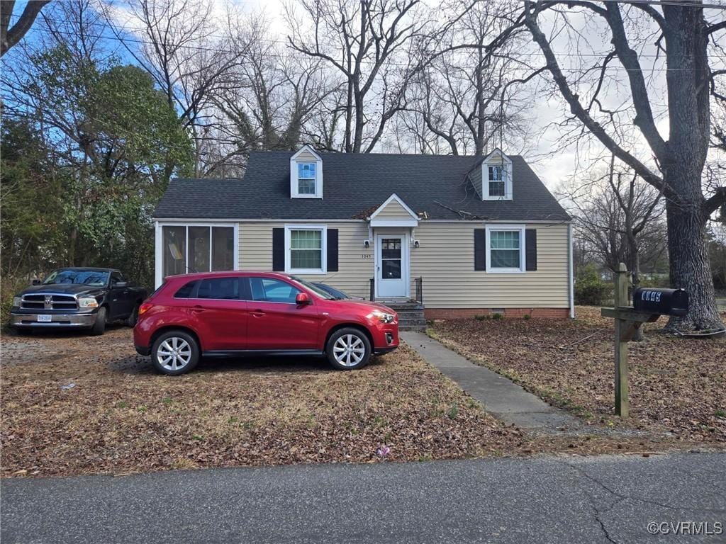 view of front of property with a shingled roof and crawl space