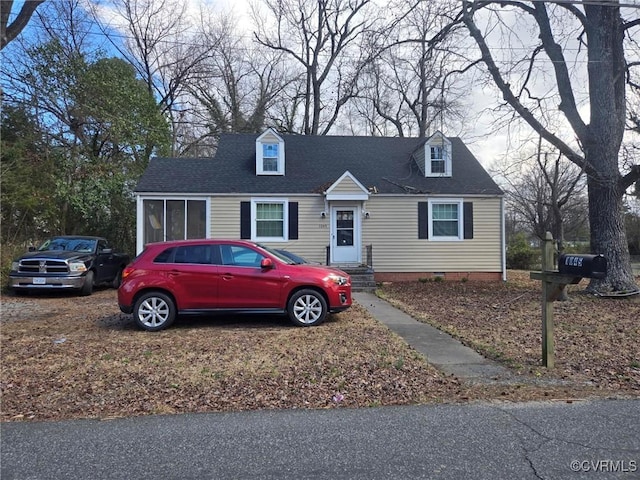 view of front of property with a shingled roof and crawl space