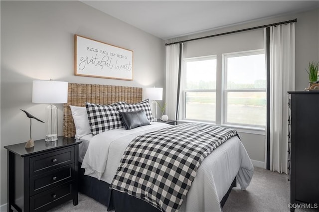 bedroom with carpet and baseboards