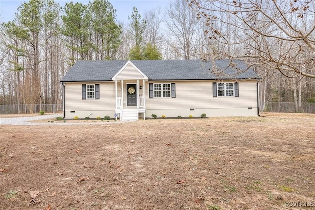 ranch-style home featuring a shingled roof, fence, and crawl space