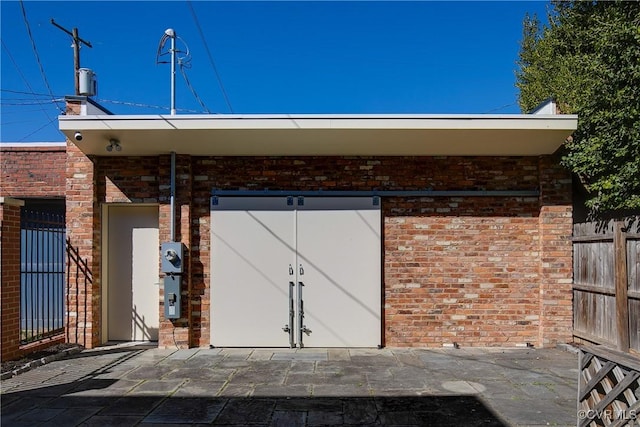 view of outdoor structure with fence