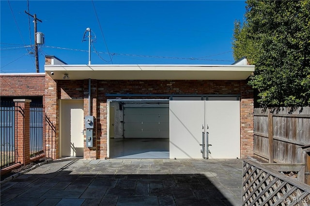 view of outbuilding with fence