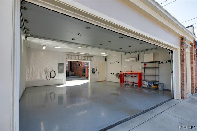 garage featuring a wall mounted air conditioner