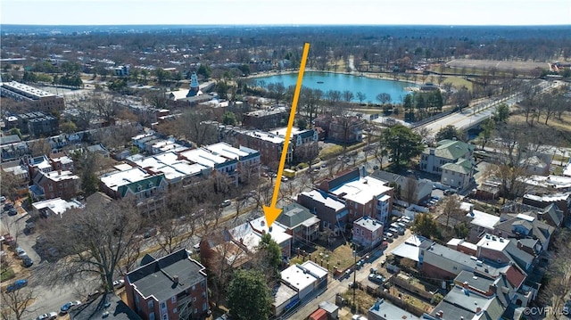 birds eye view of property with a water view