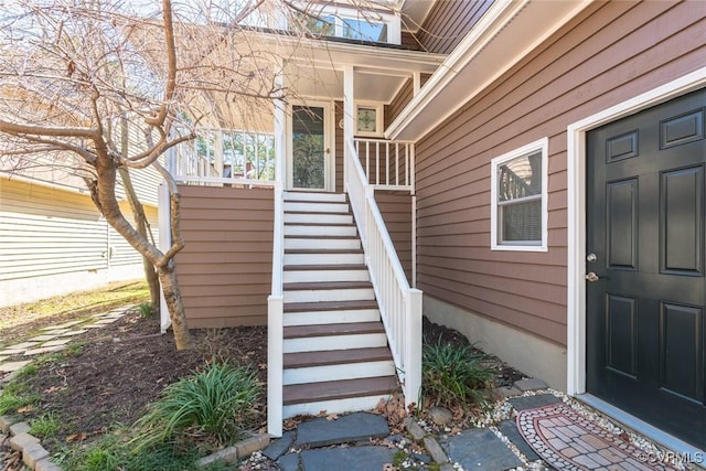 entrance to property featuring a porch