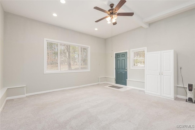 unfurnished bedroom with a ceiling fan, baseboards, carpet floors, beam ceiling, and recessed lighting