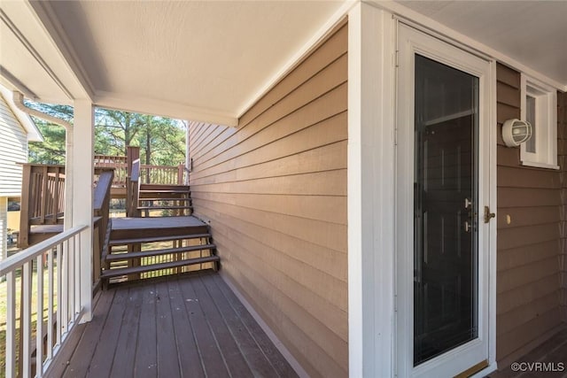 wooden terrace featuring stairway