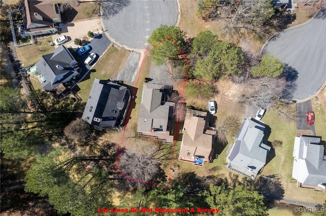 birds eye view of property with a residential view