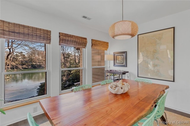 unfurnished dining area featuring visible vents and baseboards