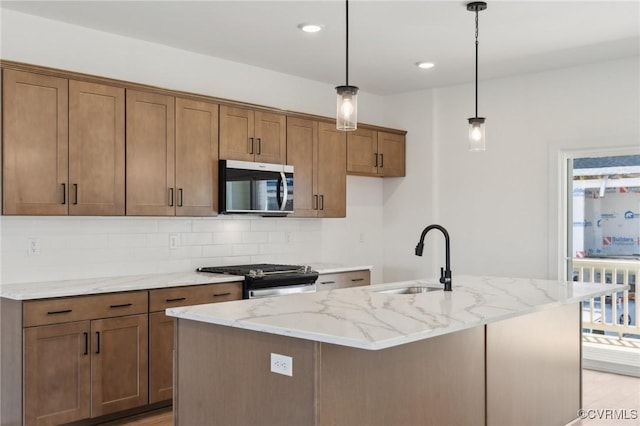 12149 Morning Walk, Henrico, VA 23233 - kitchen featuring stainless steel appliances, a sink, tasteful backsplash, light stone counters, and an island with sink