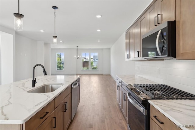 12149 Morning Walk, Henrico, VA 23233 - kitchen with stainless steel appliances, a sink, light wood-type flooring, tasteful backsplash, and recessed lighting