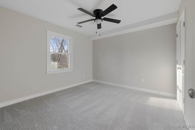 unfurnished room with baseboards, a ceiling fan, visible vents, and light colored carpet