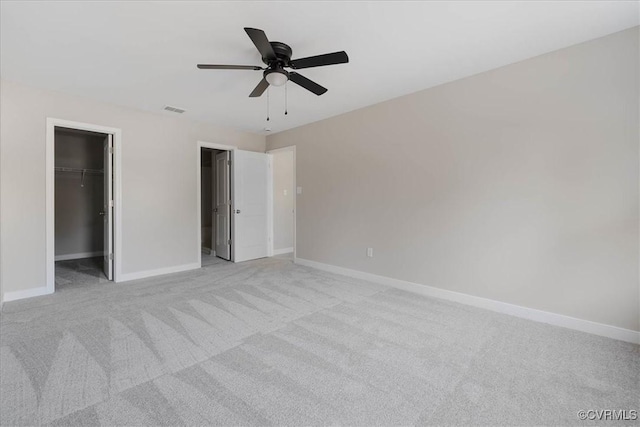 unfurnished bedroom with baseboards, visible vents, and light colored carpet