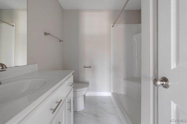 bathroom with a shower, marble finish floor, vanity, and toilet