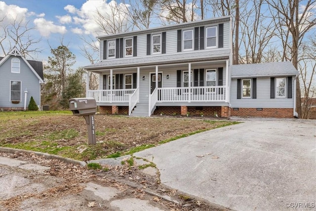 colonial house featuring a porch and crawl space