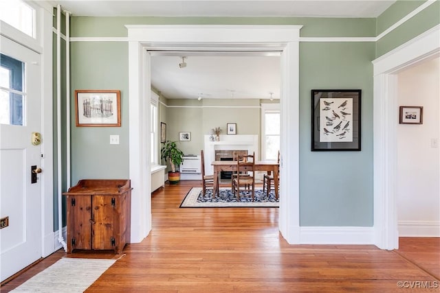 entrance foyer with light wood-type flooring and baseboards