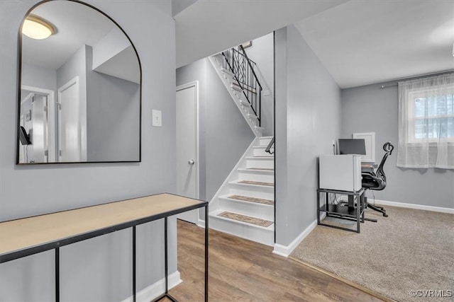 office area featuring baseboards and wood finished floors