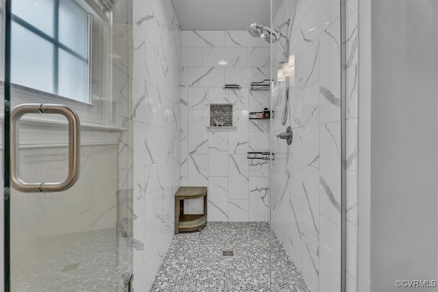 full bath with a marble finish shower