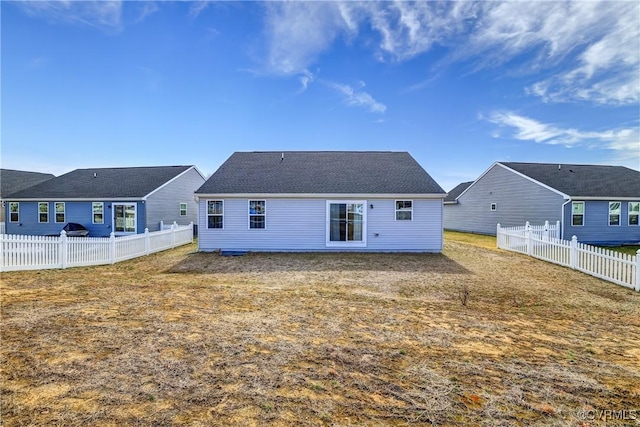 back of house featuring a fenced backyard