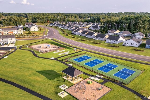 birds eye view of property with a residential view and a forest view