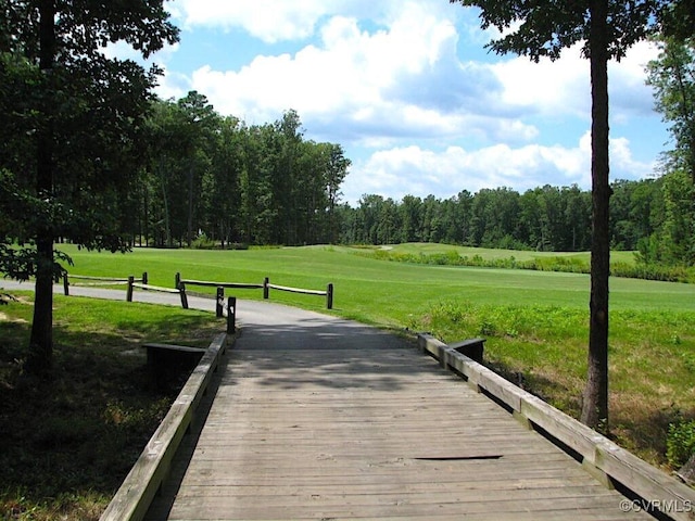 view of property's community featuring a lawn