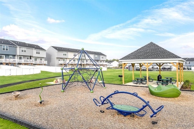 community jungle gym with a residential view, a lawn, a gazebo, and fence