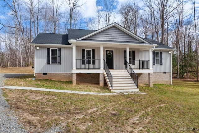 view of front facade with crawl space, stairway, a porch, and a front lawn