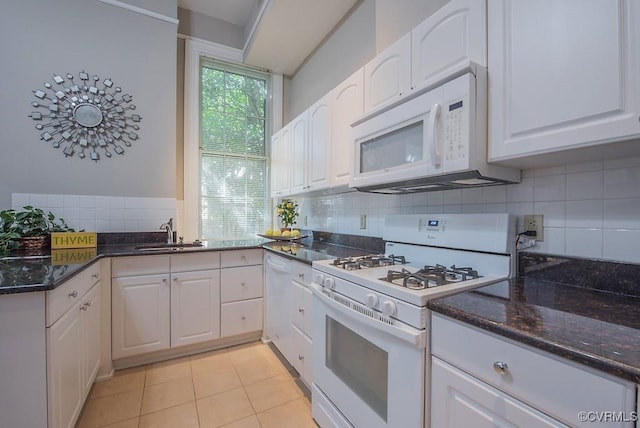 1005 W Franklin St Unit U2, Richmond, VA 23220 - kitchen with white cabinetry, a sink, dark stone countertops, and white appliances