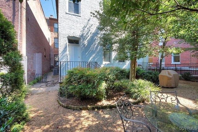 1005 W Franklin St Unit U2, Richmond, VA 23220 - view of yard featuring fence and central AC unit