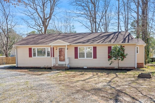 ranch-style house with fence