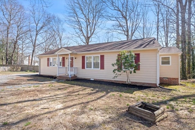 view of front of house featuring fence and crawl space