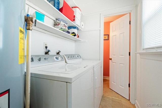 laundry room featuring washer and clothes dryer and laundry area