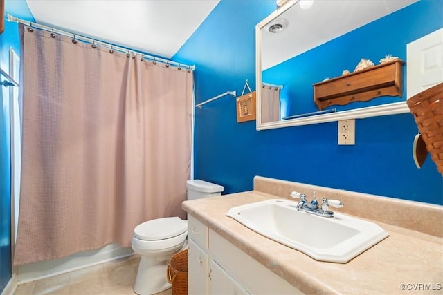 full bathroom featuring tile patterned floors, toilet, vanity, and shower / tub combo