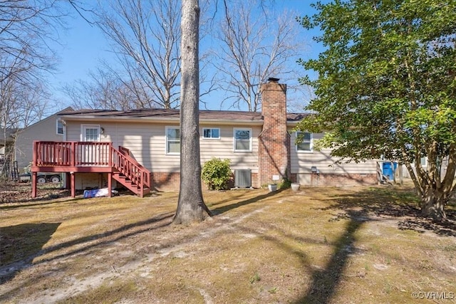 rear view of property with a deck, stairway, central AC, and a chimney