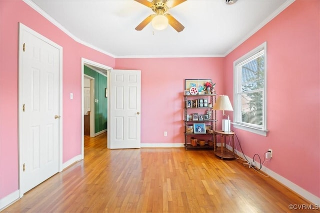 interior space featuring light wood-style floors and crown molding