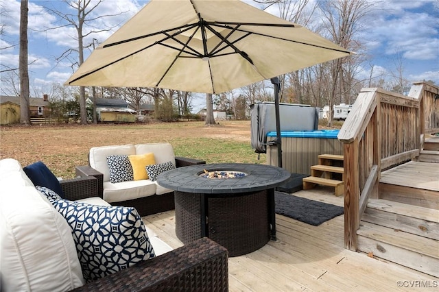 wooden terrace featuring an outdoor living space with a fire pit and central AC