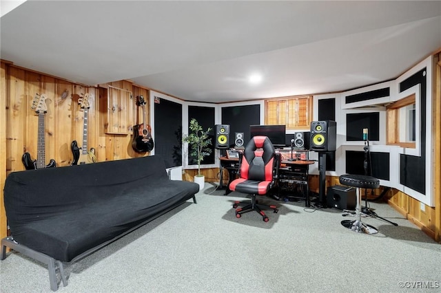 carpeted office space with wooden walls