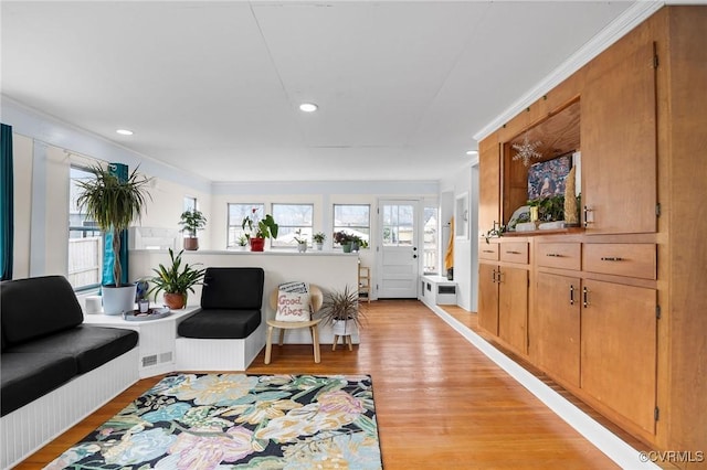 living area featuring recessed lighting and light wood-style flooring