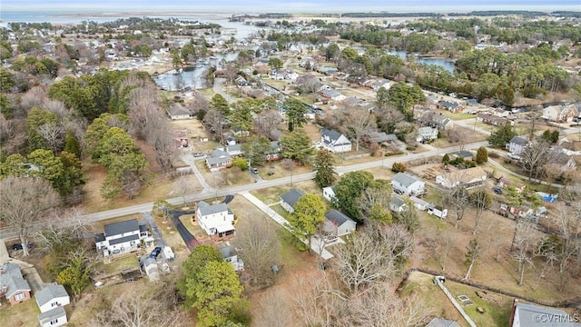 birds eye view of property featuring a residential view and a water view