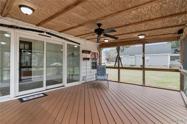 unfurnished sunroom with ceiling fan and wooden ceiling