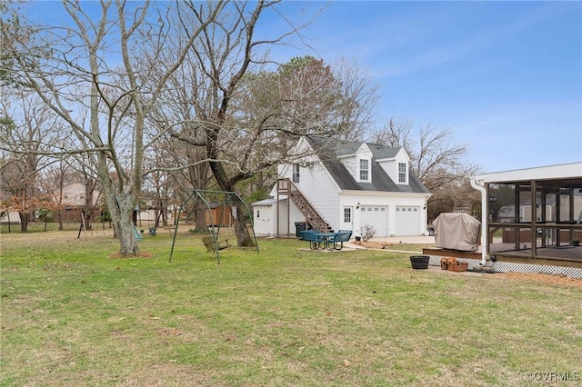 view of yard featuring stairway, a wooden deck, and a sunroom